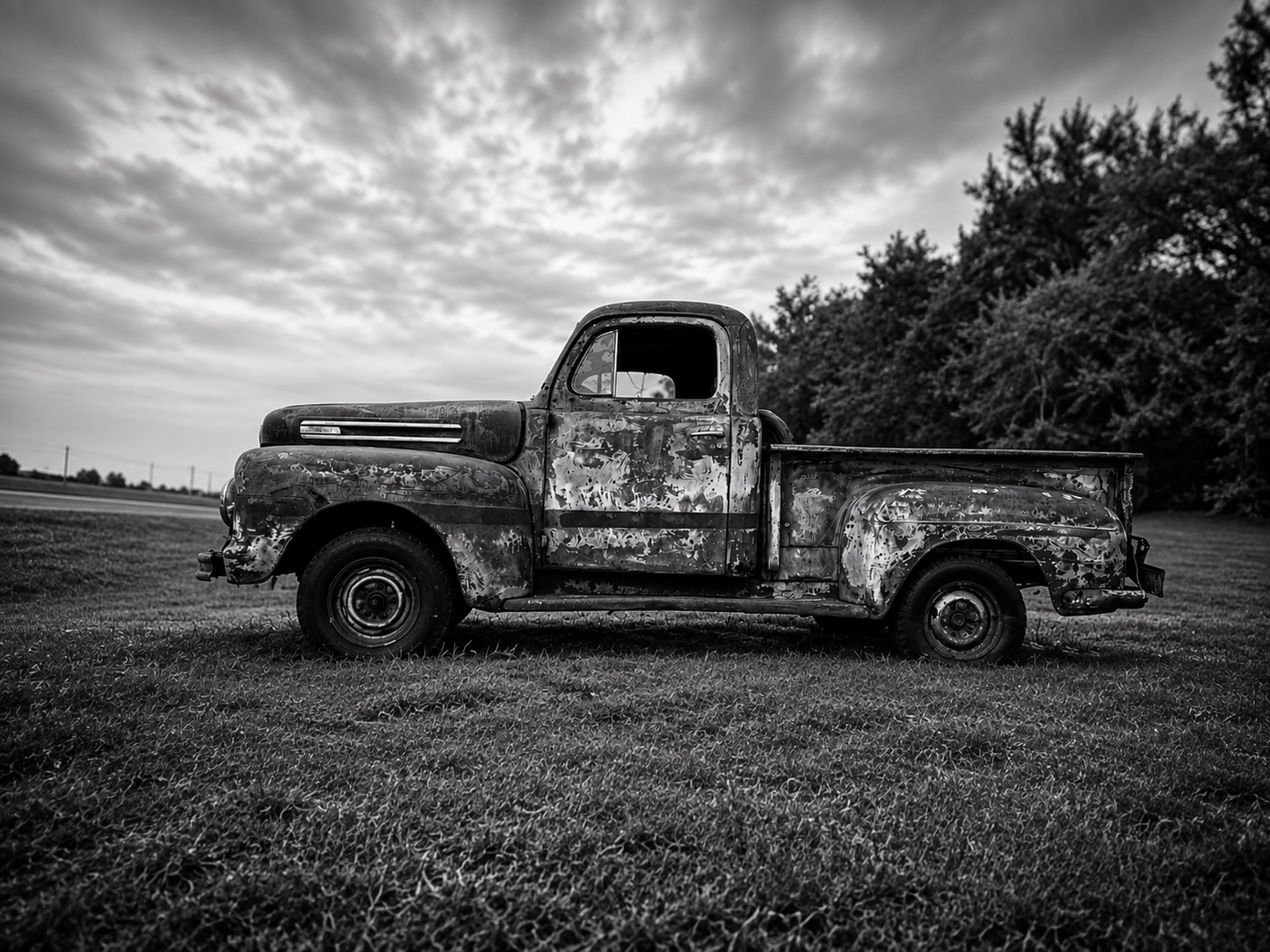 Bring the quiet beauty of rural America into your home with this striking black and white photograph of a weathered vintage farm truck resting beneath dramatic Texas skies. Rich in texture, history, and character, this fine art print celebrates the enduri