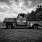 Bring the quiet beauty of rural America into your home with this striking black and white photograph of a weathered vintage farm truck resting beneath dramatic Texas skies. Rich in texture, history, and character, this fine art print celebrates the enduri